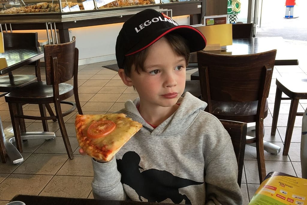 Lukas enjoying pizza for lunch