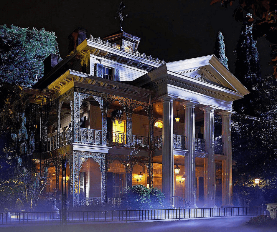 Haunted Mansion at night looking eerie and inviting