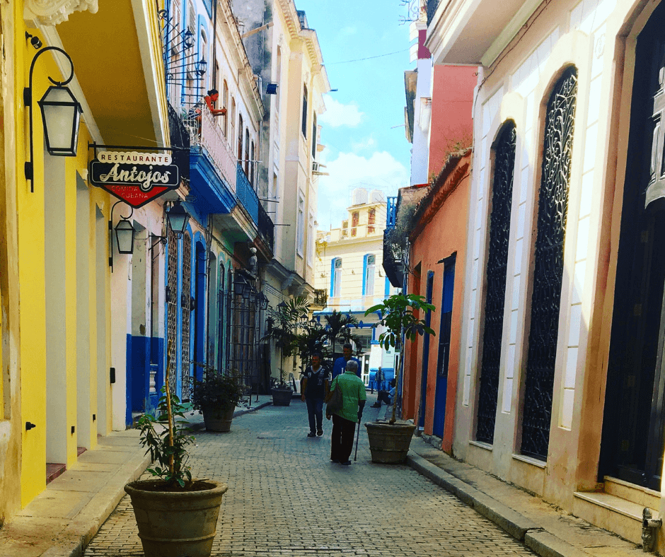 Side Street in Viejo Habana, building with rich, bright colours. One of the best things to do in Havana is just explore