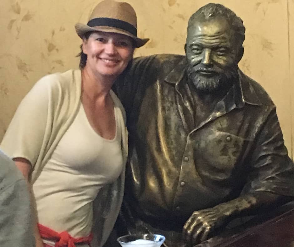 Connie posing for a photo with Hemmingway