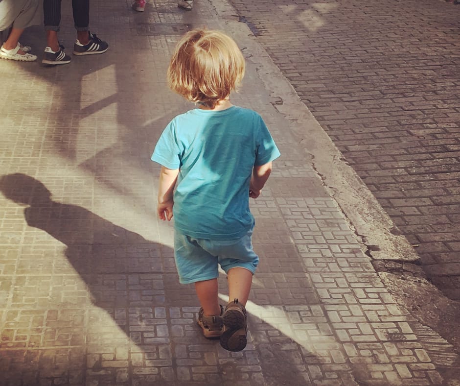Sawyer walking down a street in Havana