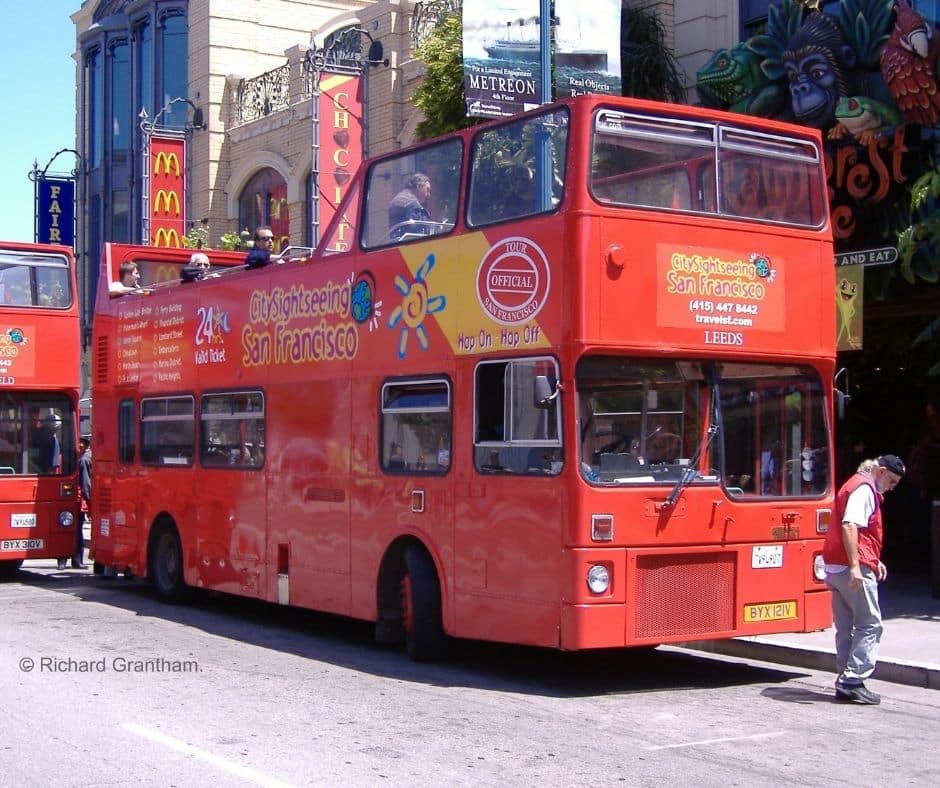 Two storied open top tour bus, parked and ready to go