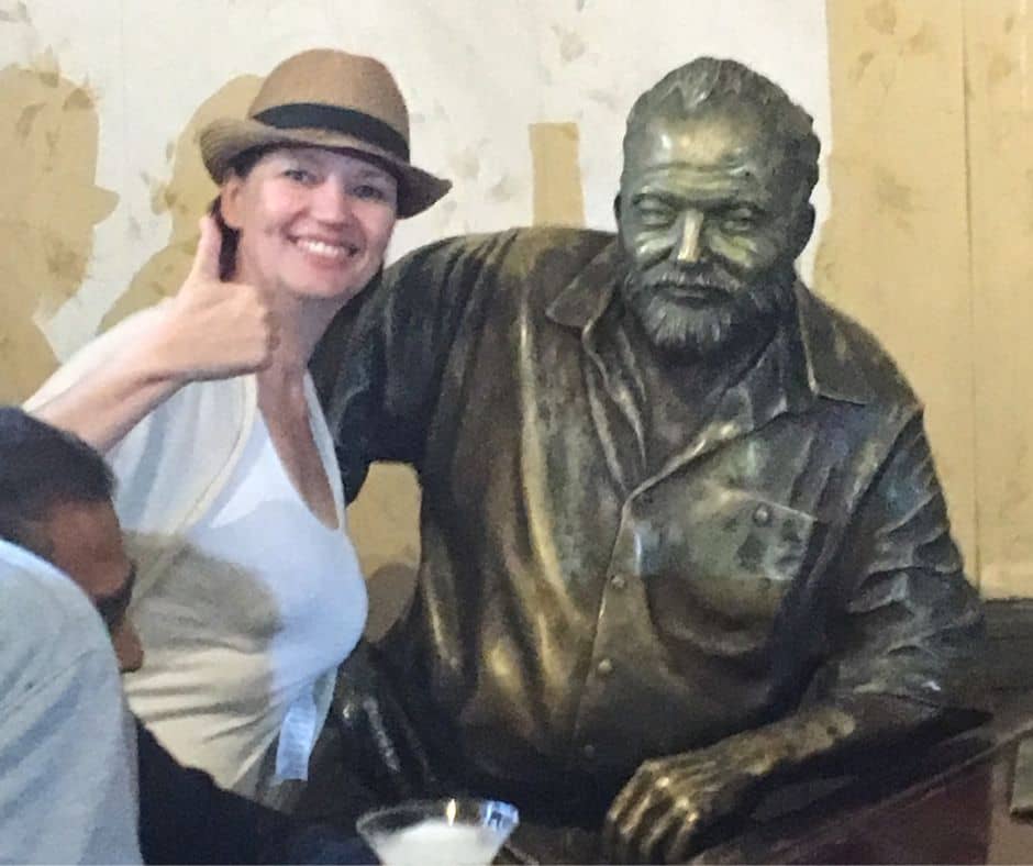 Connie posing for a photo with Ernest Hemingway 