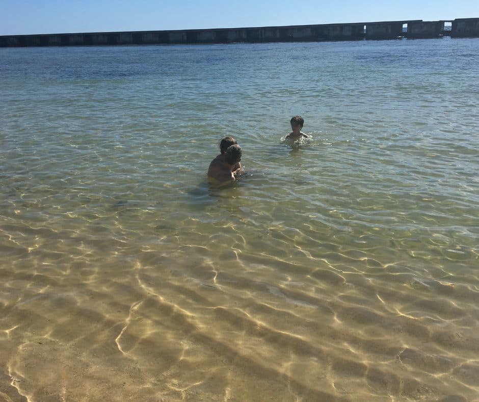 Boys relaxing in the waters of Playa Giron