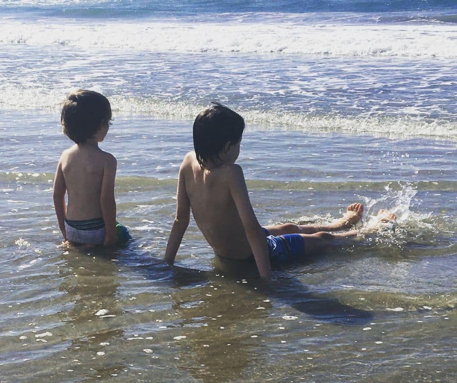 The boys relaxing in the waters of Mount Maunganui, spending time in the water is a must in Mount Maunganui